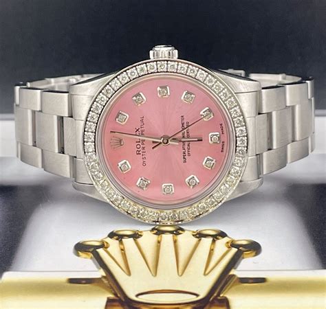 pink rolex on wrist